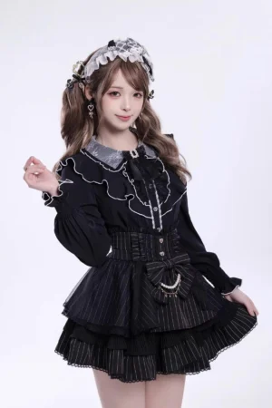 Black ruffled collar Jirai Kei long-sleeve blouse with pintuck details front three-quarter view worn by model with Gothic Lolita styling