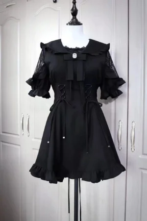 Black Jirai Kei sailor dress with lace ruffle sleeves and corset lacing displayed on dress form front view