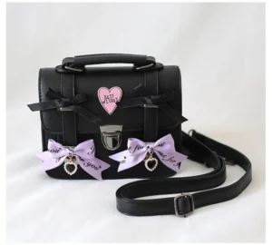 Black Jirai Kei PU leather satchel bag with light purple bows heart patch and adjustable shoulder strap detail