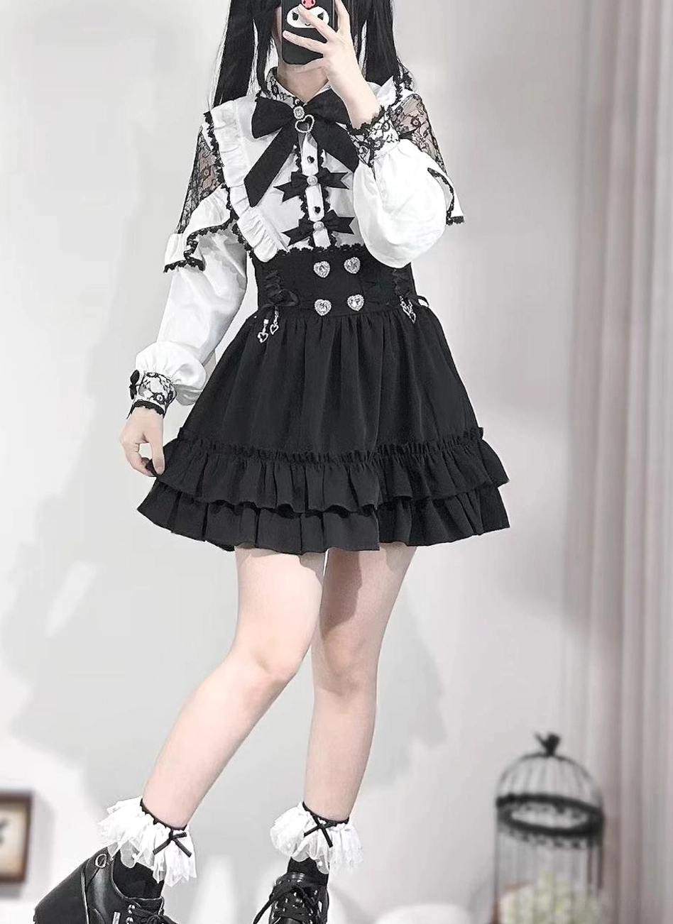 Gothic Jirai Kei black skirt with heart rhinestone decorations and high-waisted silhouette, worn with platform leather shoes, displayed in mirror selfie oblique side view showing ruffle hem layers