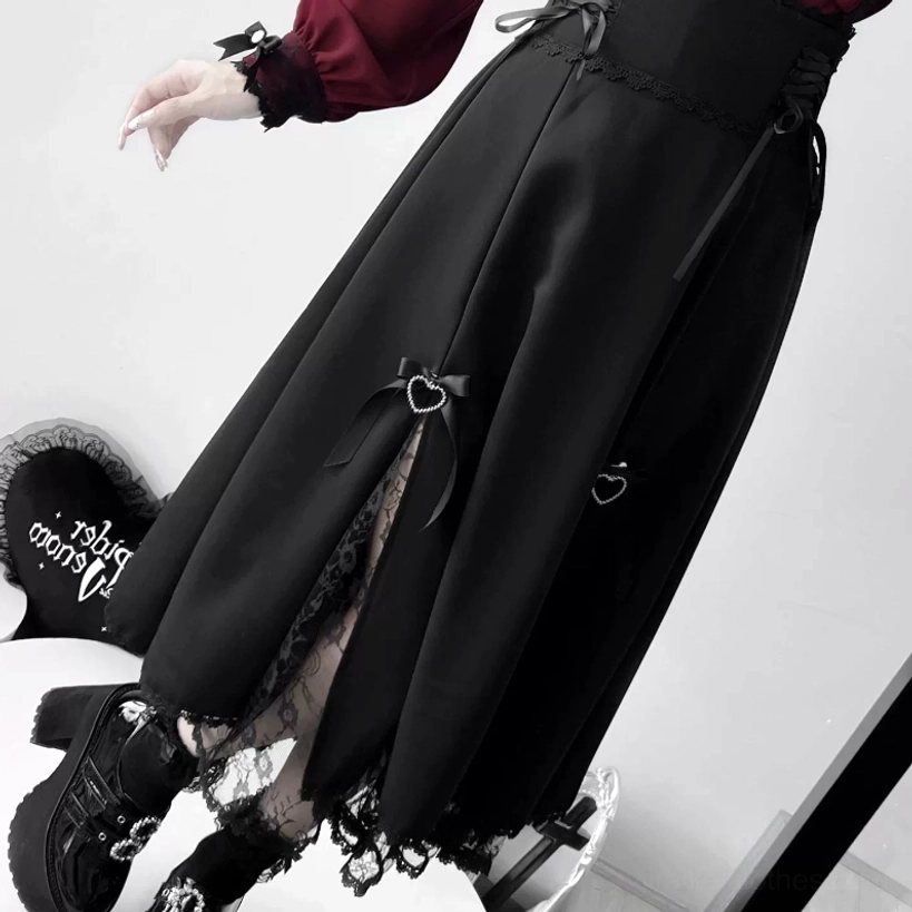 Black jirai kei skirt detail close-up side view lace hem and heart bow trim slit skirt with platform shoes lace socks