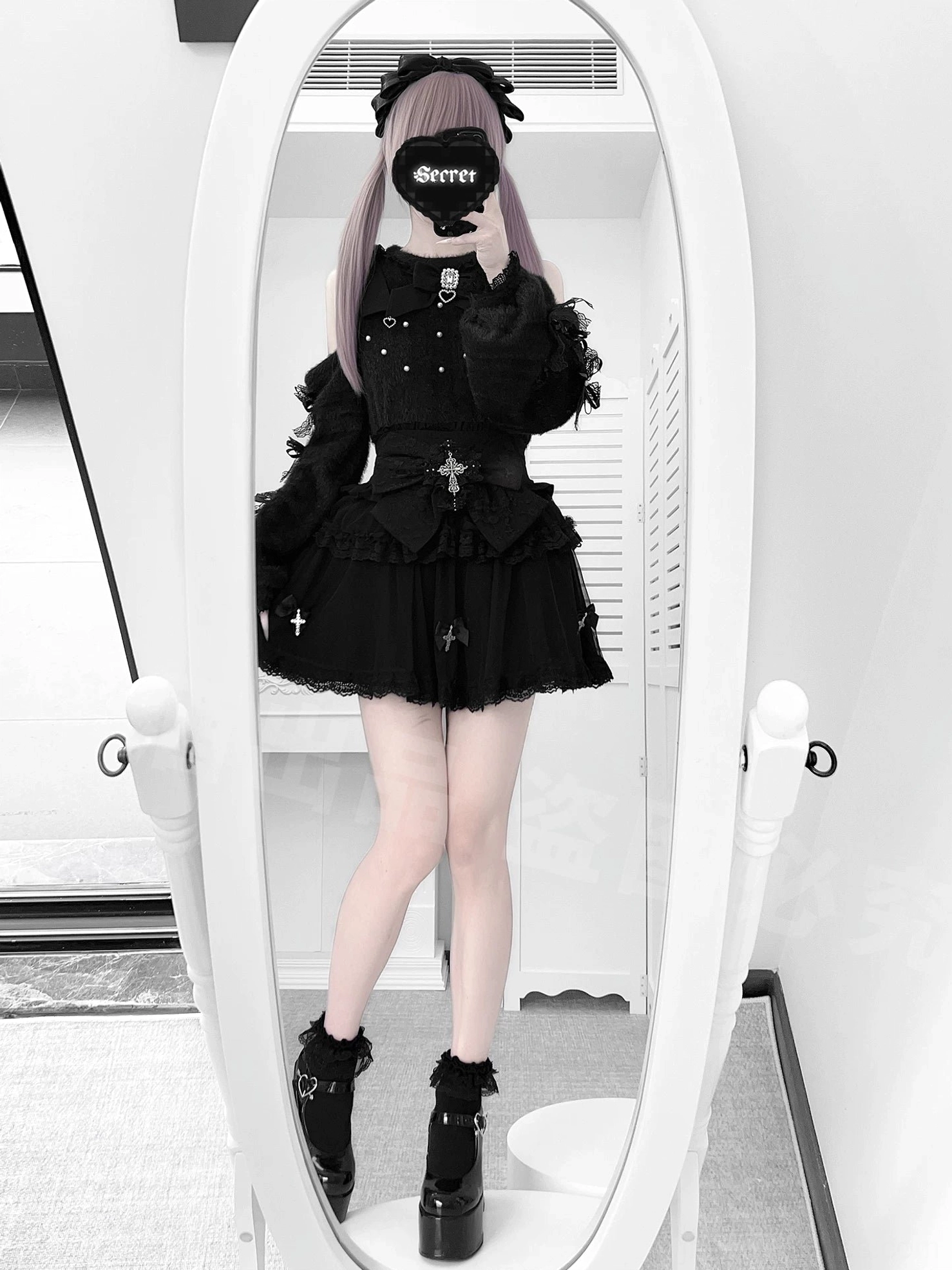 Black off-shoulder Jirai Kei sweater with ruffle lace hem and high-waist skirt from back view, rear full-length mirror shot with platform boots showcasing silhouette