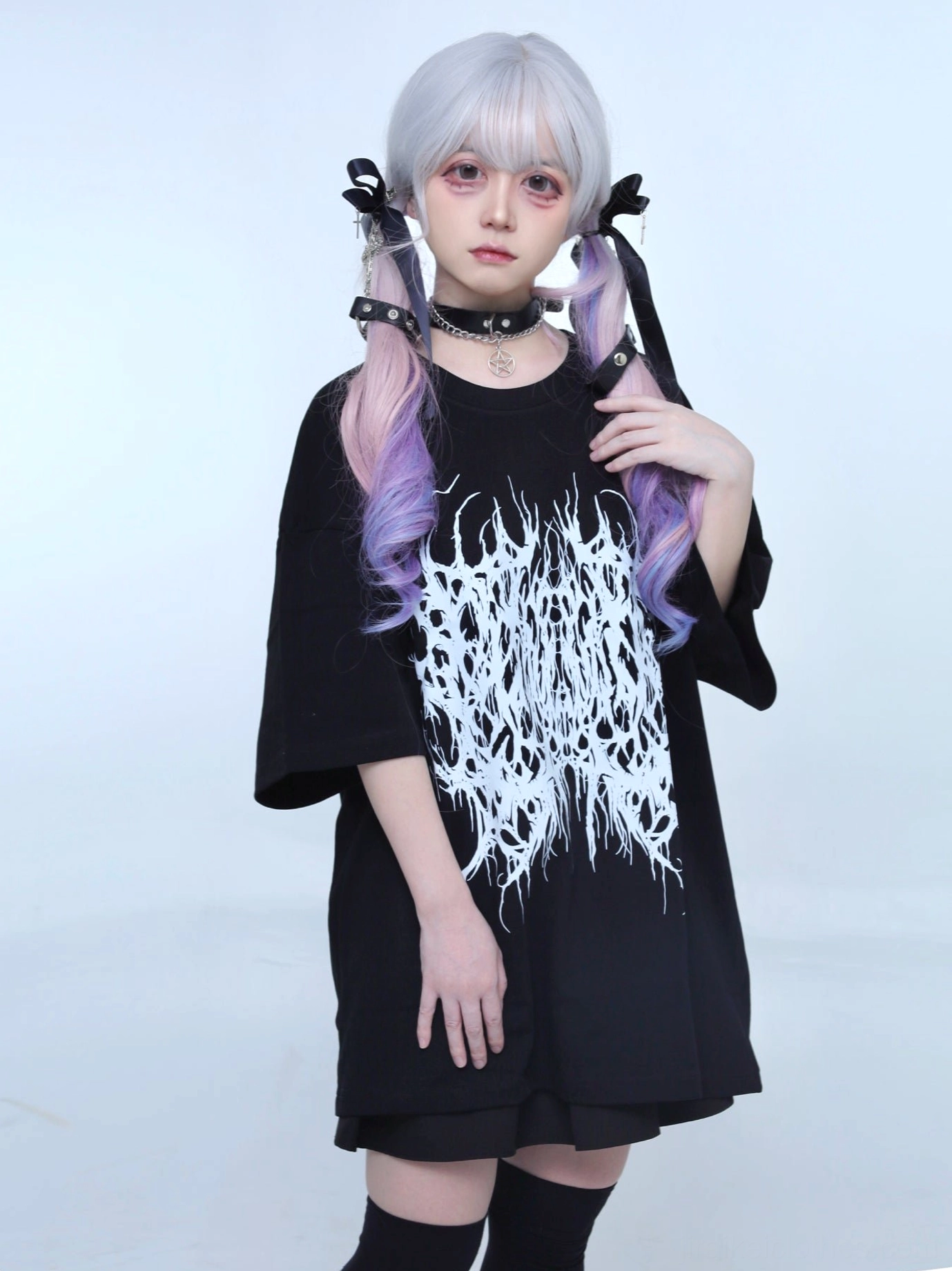 Oversized black gothic Jirai Kei t-shirt medium shot front view brutal white metal typography print crew neck relaxed fit