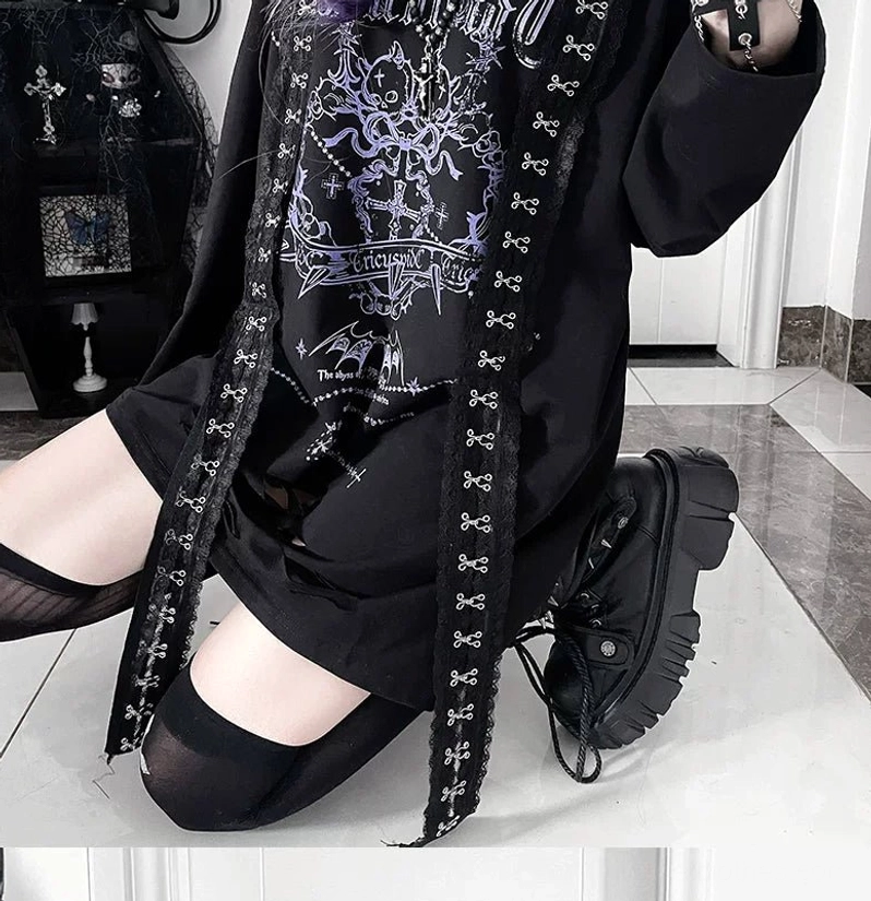 Graphic print detail of black goth long-sleeve tee featuring rebellious chest artwork and dark subculture symbolism central to Jirai Kei aesthetic movement