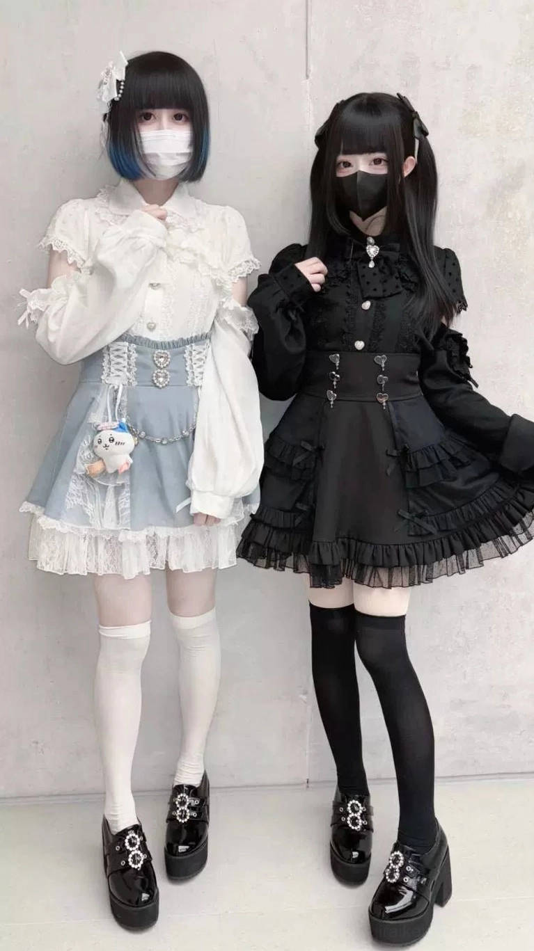 Gothic versus sweet style comparison black Jirai Kei high-waist tiered skirt with blue lolita skirt alternative fashion aesthetic