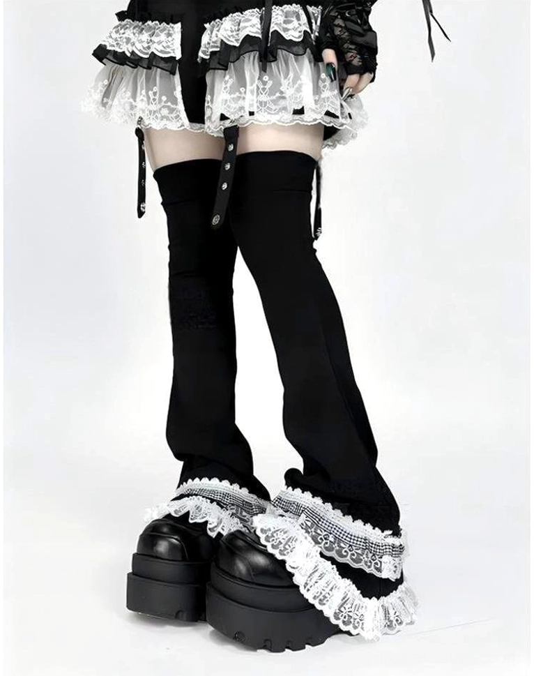 Lace-trimmed goth leg warmers featuring double-layer white ruffles and black flared design with buckle fasteners, low-angle leg showcase