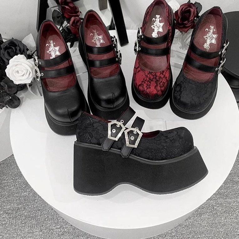 Black matte leather Mary Jane platform shoes showing thick EVA sole construction and dual silver decorative buckles side profile view