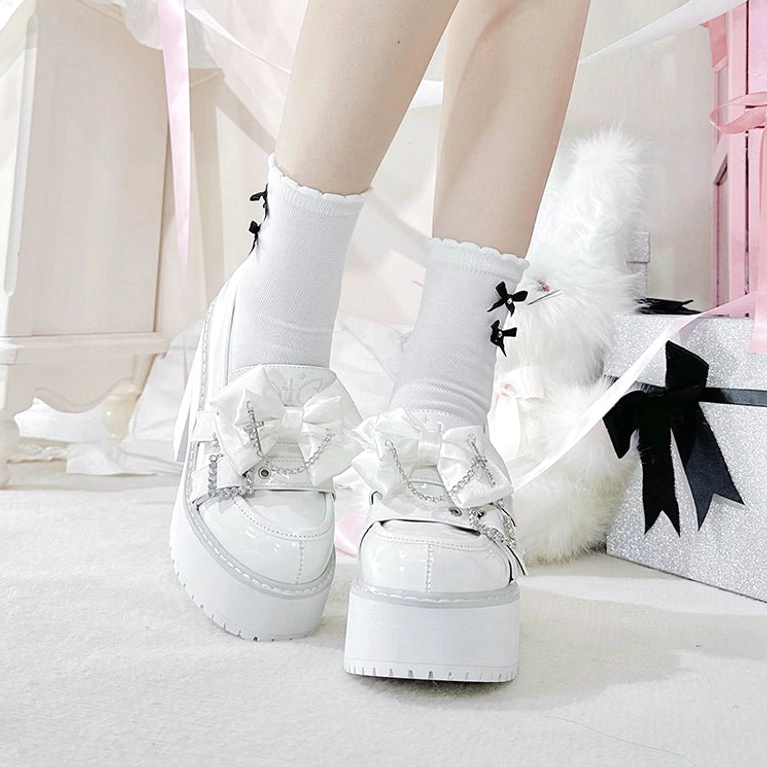 Black patent leather Jirai Kei platform shoes worn styling example showing how to pair with black ruffled skirt, lace socks, demonstrating authentic Jirai Kei subculture fashion aesthetic and attitude