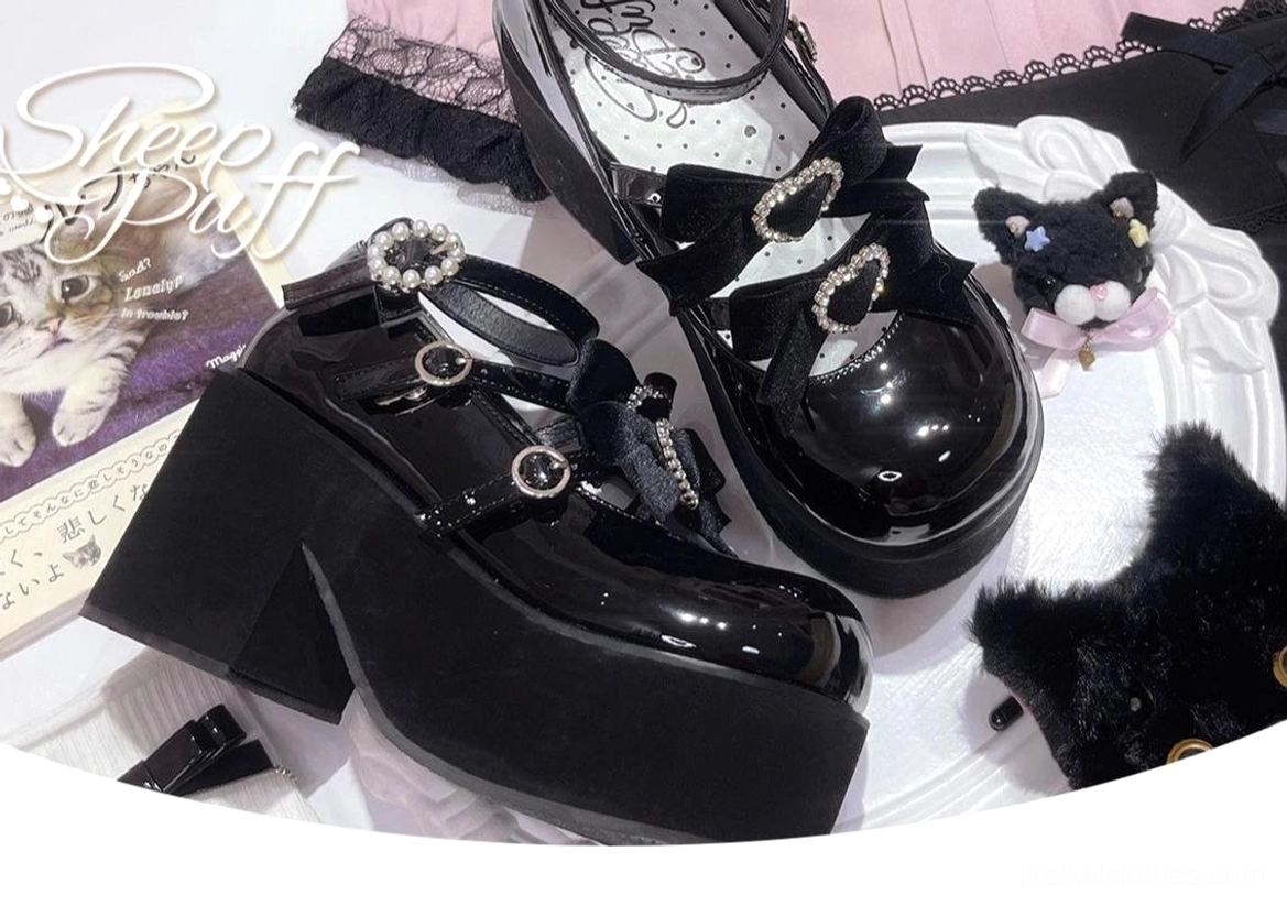 Black-pink color variation of jirai kei platform shoes with velvet butterfly bow and sparkling heart rhinestone embellishments on glossy patent leather