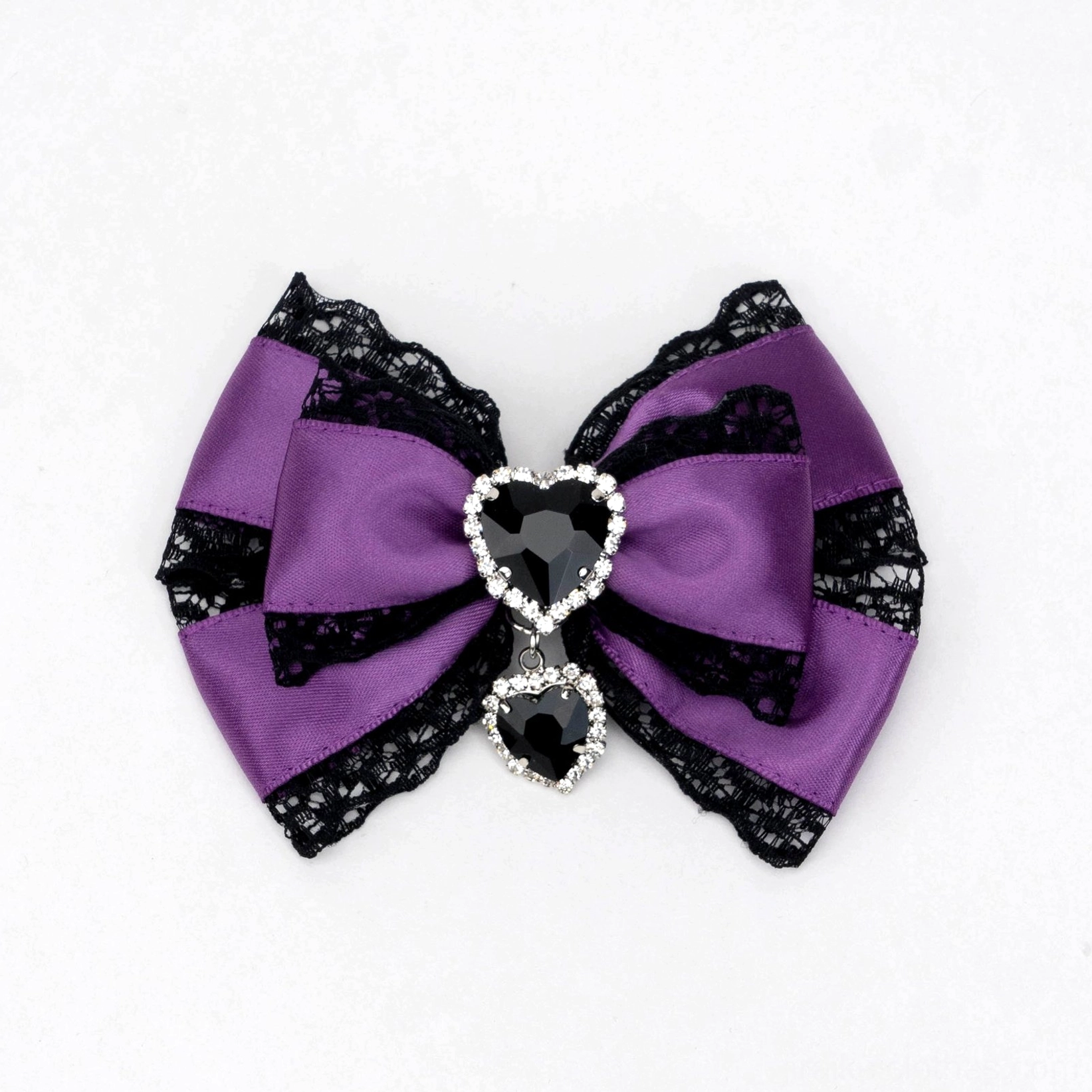 black and purple jirai kei satin bow hair clip with black lace edging heart rhinestone charm dangling detail