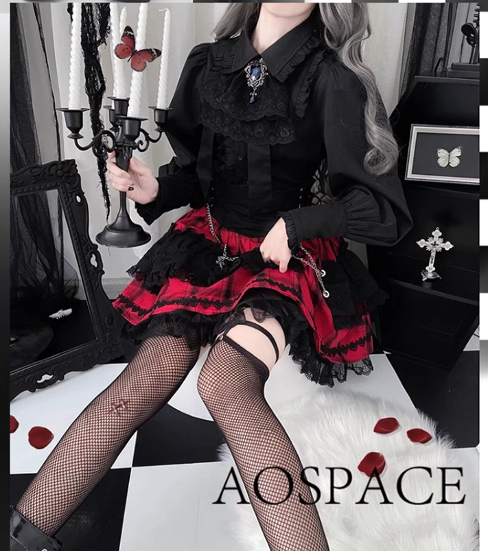 Black and red Jirai Kei Gothic Lolita two-piece set seated pose with fishnet stockings garter