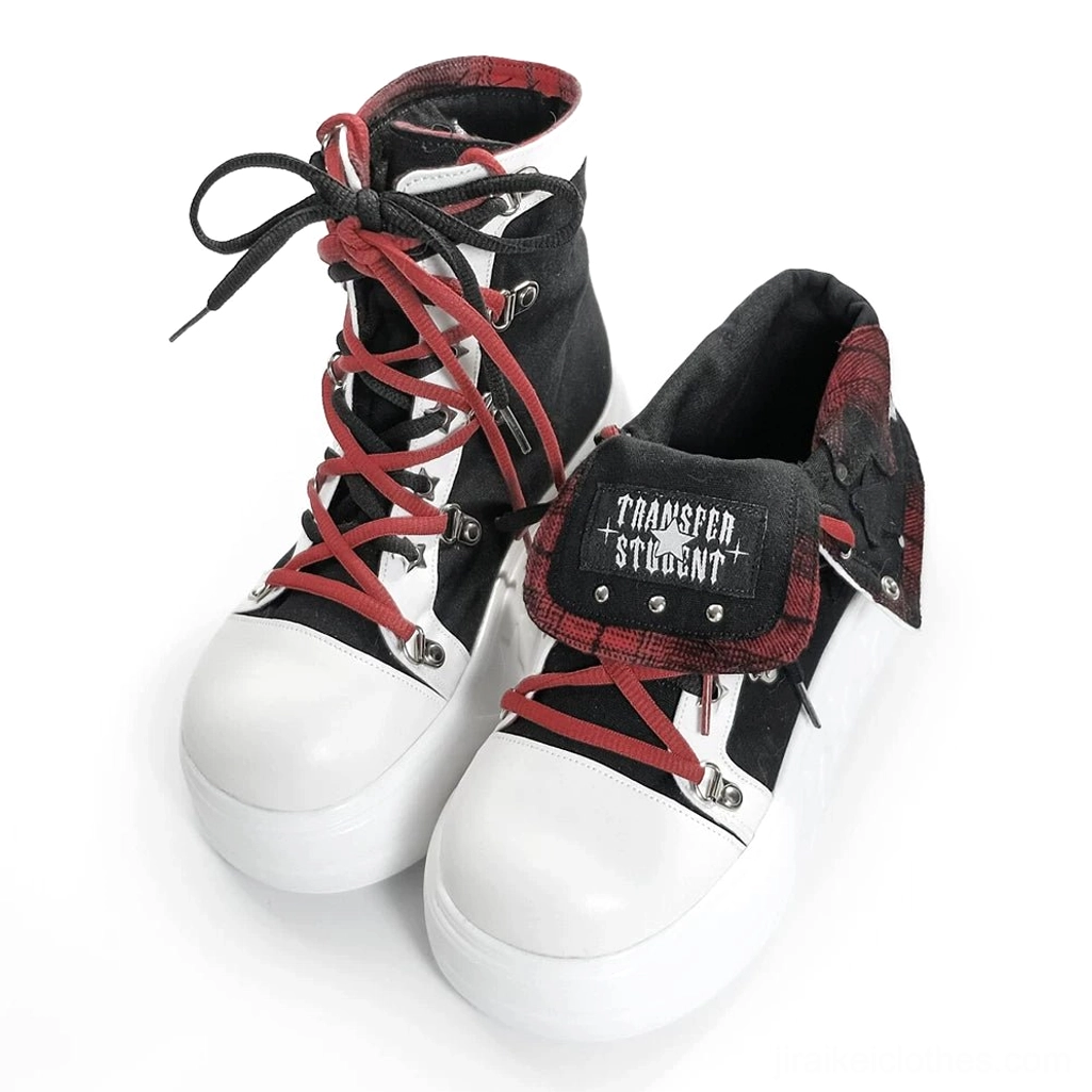 Front closeup of black-red Jirai Kei platform high-top shoe featuring red dual contrasting laces and plaid foldable collar design on white background