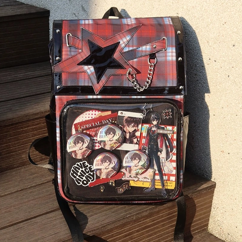 Black-red plaid star ita backpack full front view with clear acrylic display window and metal chain detailing