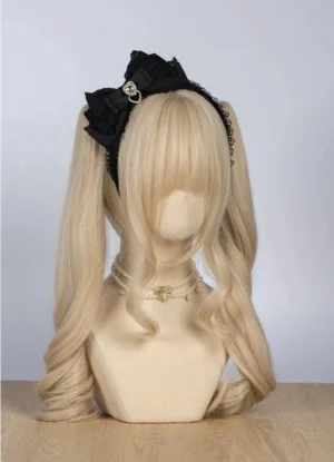 Black ryousangata triple-layer bow hair accessory with heart rhinestone embellishment flat lay view, lace-trimmed edges perfect for Ryousangata Jirai Kei aesthetic