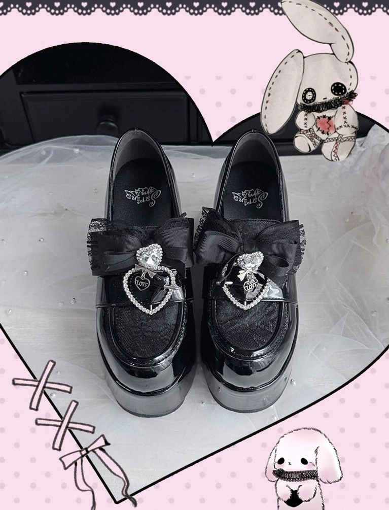 Black Ryousangata platform loafers variant showcasing glossy PU leather finish and lace toe cap detail in studio lighting