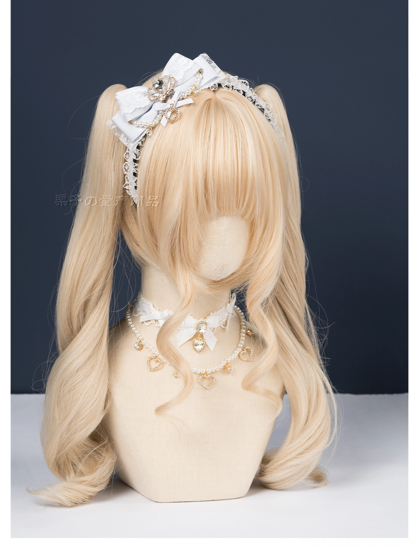 Black ryousangata plush bow headband three-quarter mannequin view soft luxurious texture dark studio