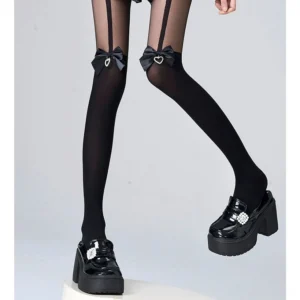 Black ryousangata velvet thigh-high stockings with heart rhinestone charm bow, side half leg view with platform loafers, jirai kei styling