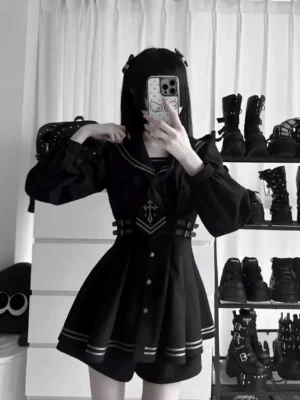 Back view of black sailor collar JK uniform featuring lace-trimmed sailor collar, puff sleeves, and waist belt detail with cross emblem design