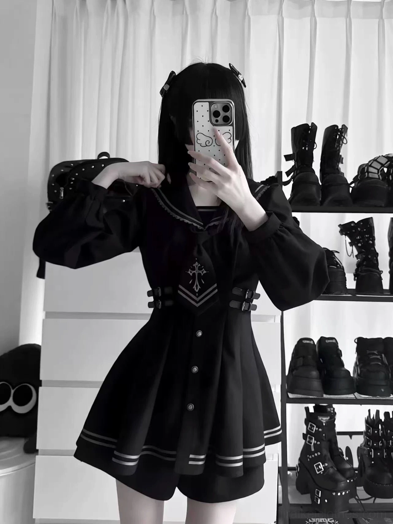 Back view of black sailor collar JK uniform featuring lace-trimmed sailor collar, puff sleeves, and waist belt detail with cross emblem design