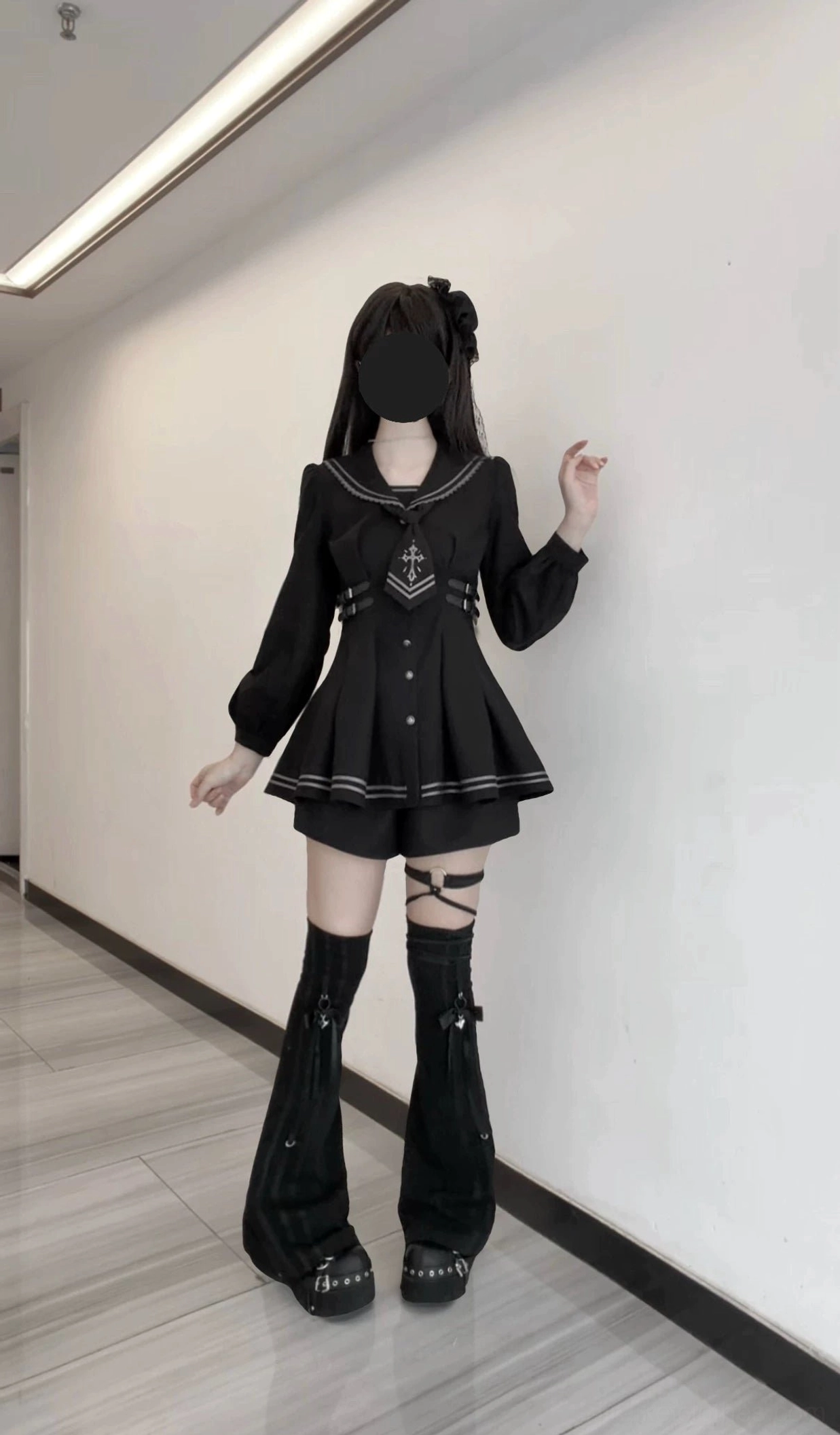 Full body side view of black sailor collar JK uniform dress with pleated skirt, cross-embroidered detachable necktie, and lantern sleeves