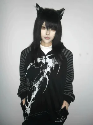 Black hooded scythe print zip coat with grey striped raglan sleeves worn by model with cat ear accessories front half-body view Jirai Kei dark aesthetic streetwear
