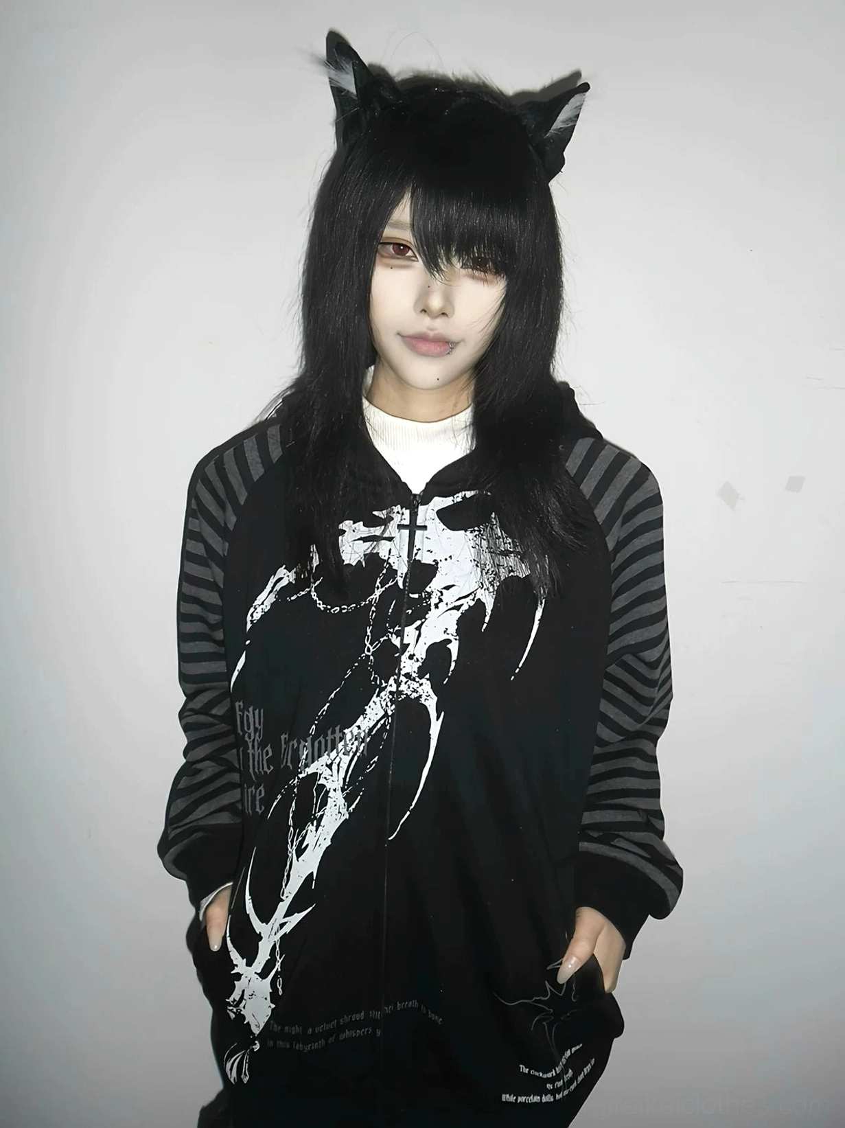 Black hooded scythe print zip coat with grey striped raglan sleeves worn by model with cat ear accessories front half-body view Jirai Kei dark aesthetic streetwear