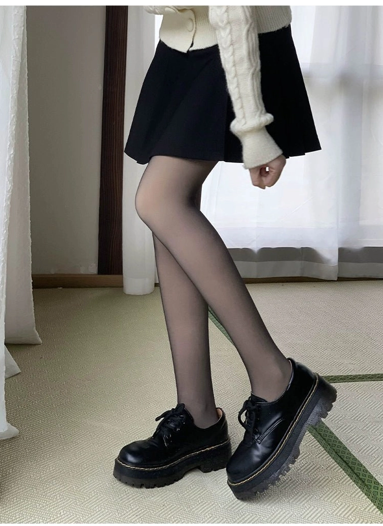Black sheer tights jirai kei low-angle front view pleated skirt loafers