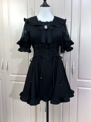 Black slim fit sailor Jirai Kei dress with flared ruffled sleeves and large collar bow detail on mannequin