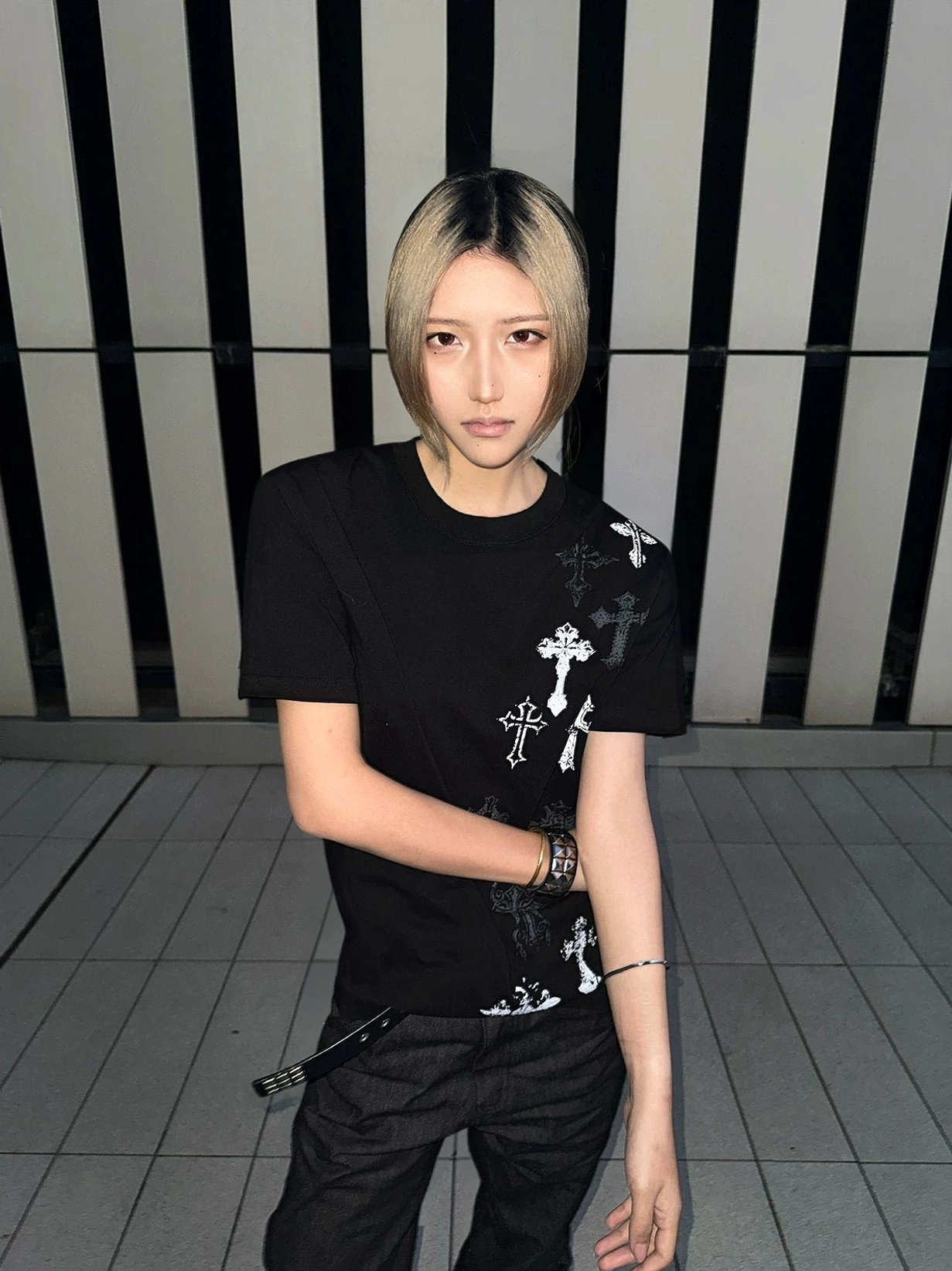 Black t-shirt with cross prints detail view showing print quality, color intensity, and durability of graphics on heavyweight cotton fabric