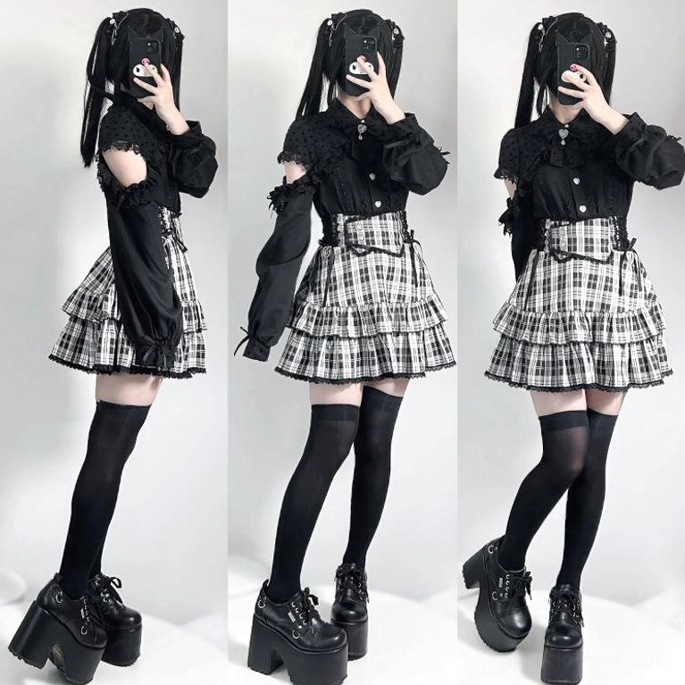 Black-white plaid layered ruffled mini skirt with black button-up blouse and twin ponytails, full-body mirror selfie showcasing chaotic-cute aesthetic