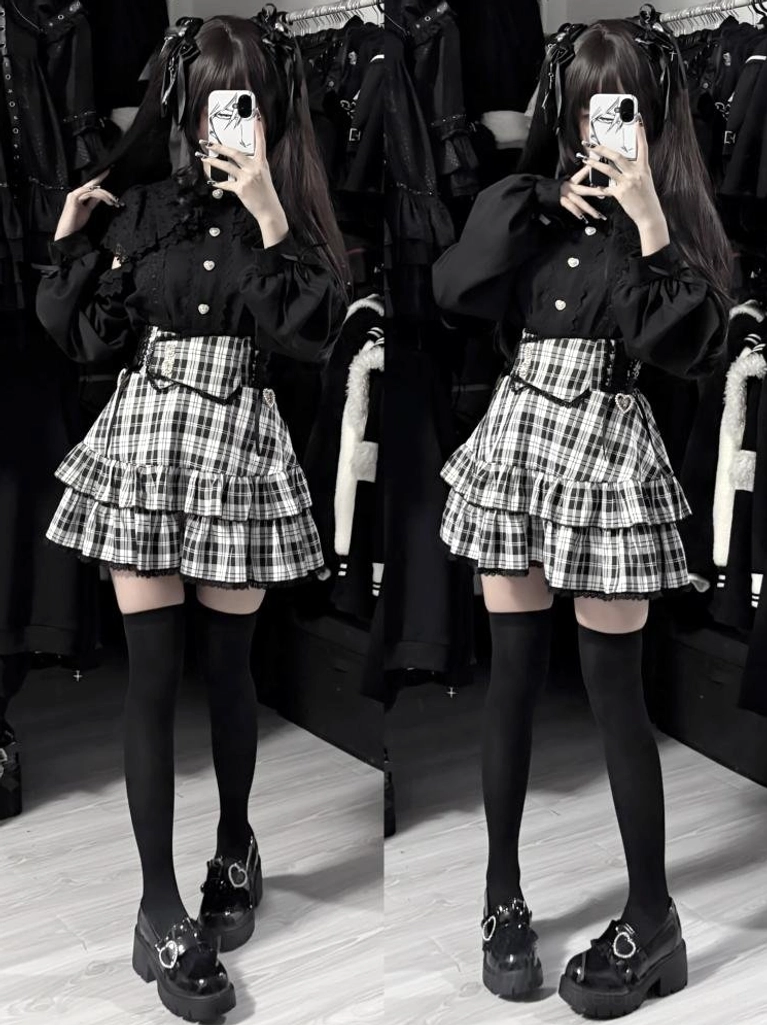 Black-white plaid tiered ruffle Jirai Kei mini skirt with lace trim, worn with black blouse and thigh-high stockings, full-body front view mirror selfie