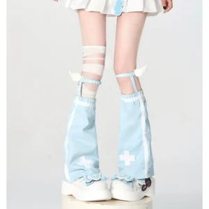 Light blue angel wing leg warmers with white cross prints and side stripes worn with platform sneakers and mini skirt