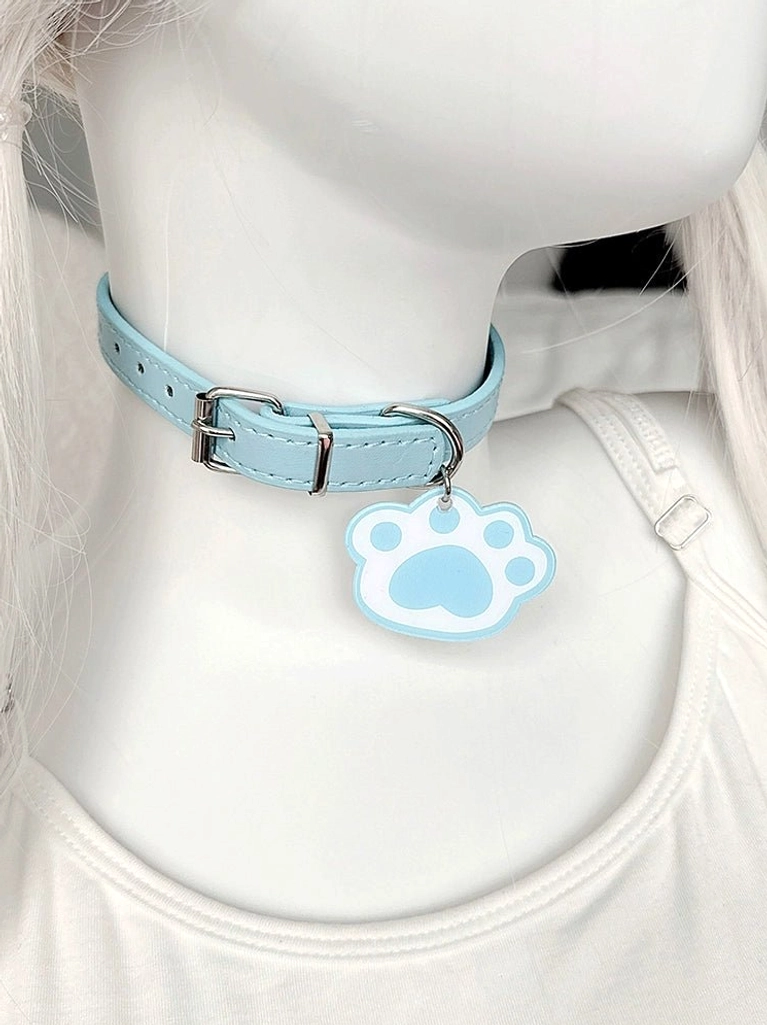 Pastel blue leather cat paw choker with silver buckle and blue-white paw charm, side angle view on twin-tail mannequin, cute Jirai Kei accessory
