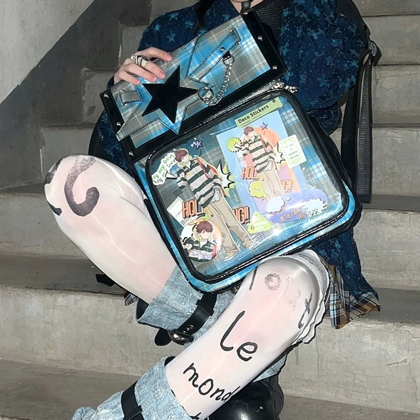 Blue-green plaid star ita backpack front showcase with collectible anime goods in display window