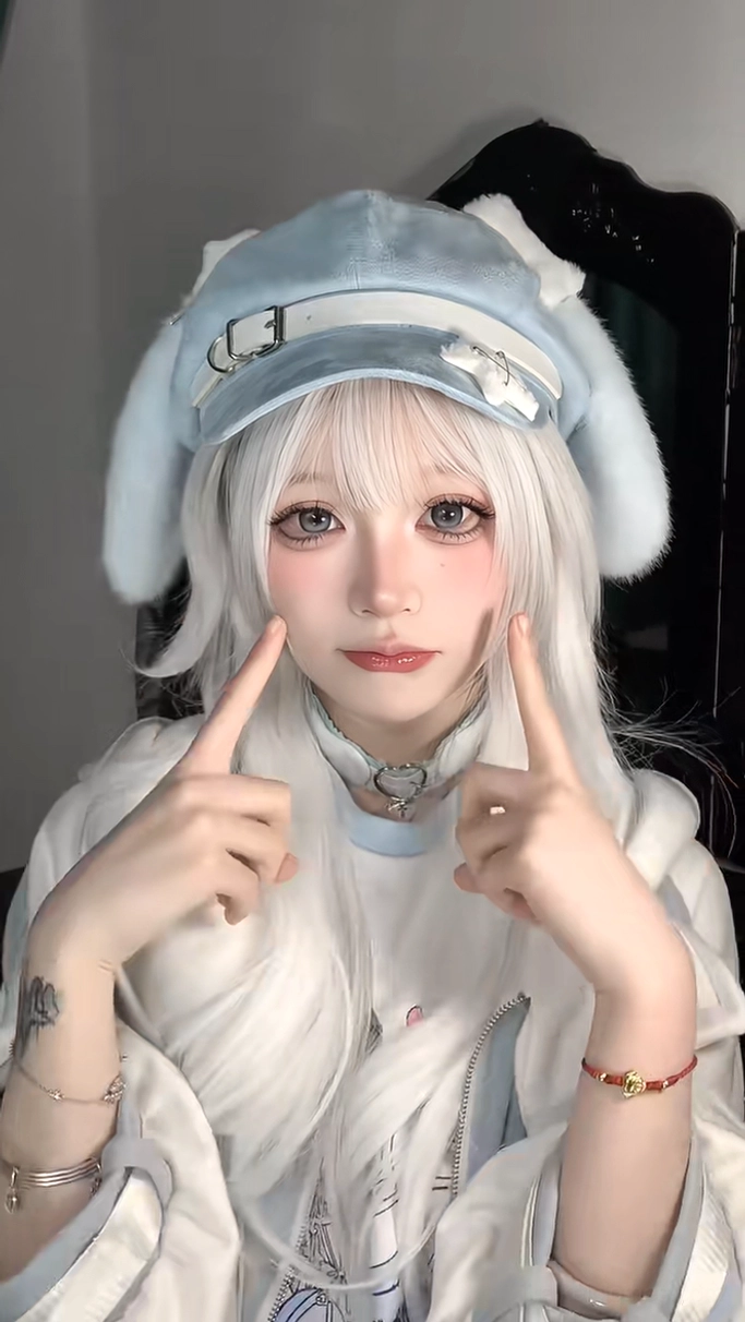 Blue puppy ear beret frontal view on model with long white hair, featuring fluffy light blue fabric and white decorative strap, perfect Jirai Kei Tenshi accessory