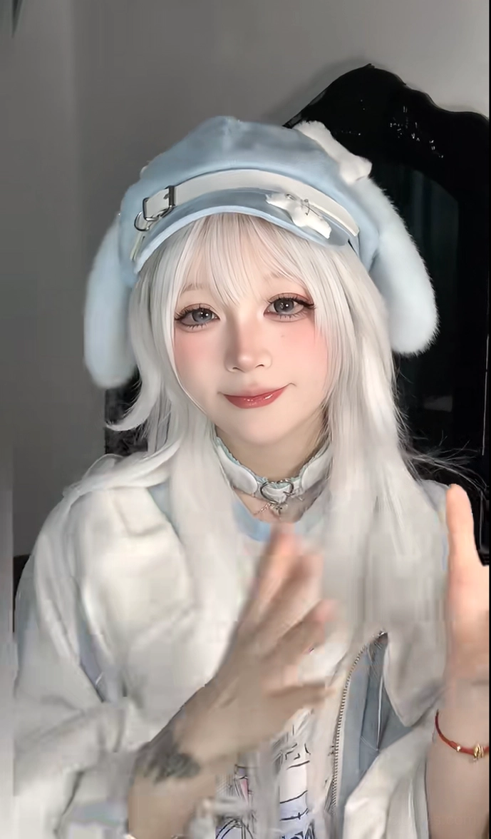 Three-quarter view of blue puppy ear beret on model with white hair and silver choker, displaying plush ears and white strap decoration