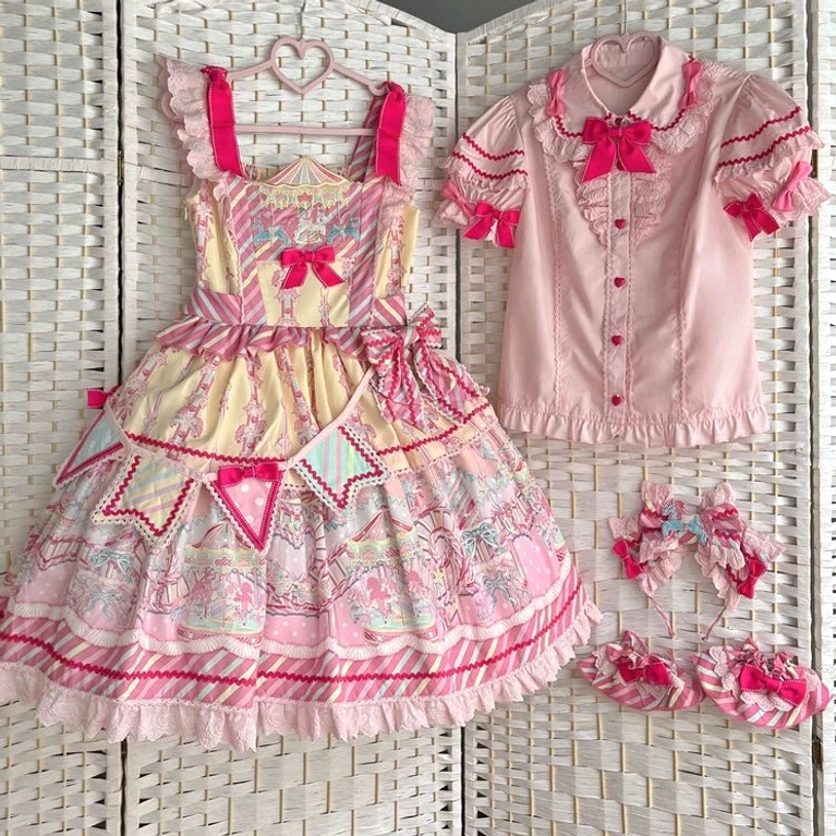 Blue salopette Jirai Kei dress front view showing hollow-back design and amusement park print aesthetic