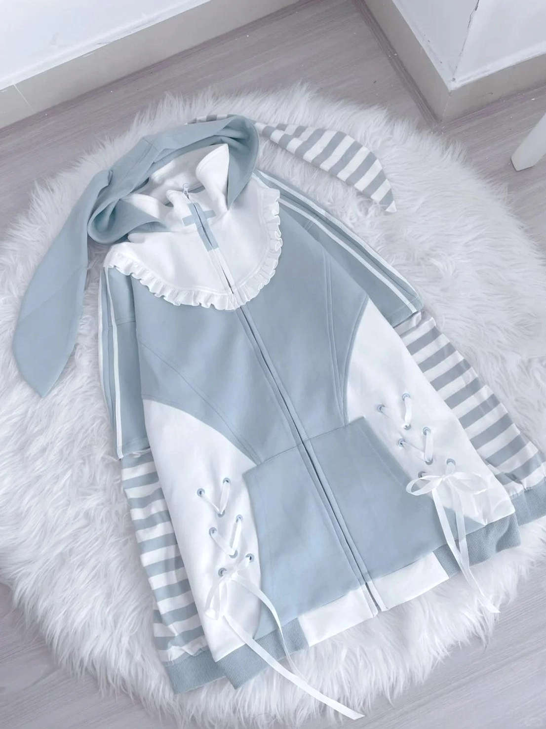 Fabric texture and material detail of blue Tenshi Kaiwai hoodie showing 90% cotton 10% spandex blend quality