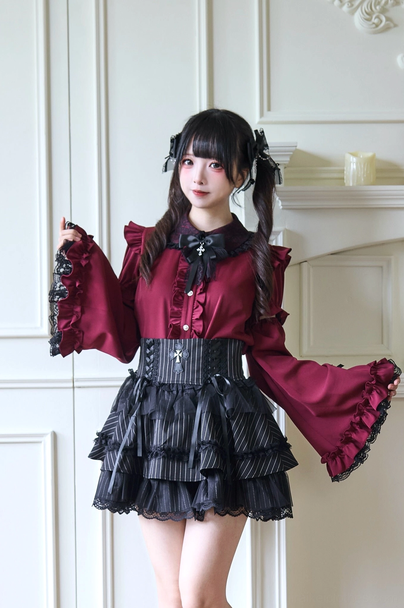 Burgundy Jirai Kei blouse with detachable princess sleeves and cross-embellished bow collar styled with black platform boots and corset waist belt