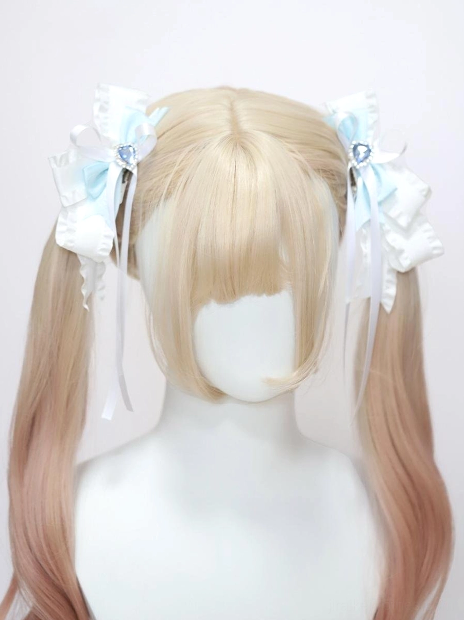 Butterfly hair clips on straight blonde hair showing dual ribbon layers blue heart crystal and hidden alligator hairpin mechanism