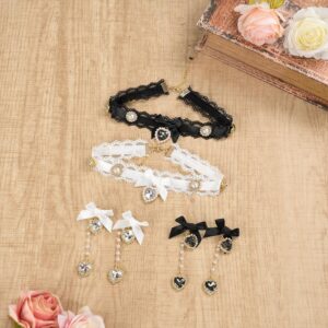 Black lace and white satin Jirai Kei choker set with dangle earrings arranged on wooden desktop surrounded by pink roses