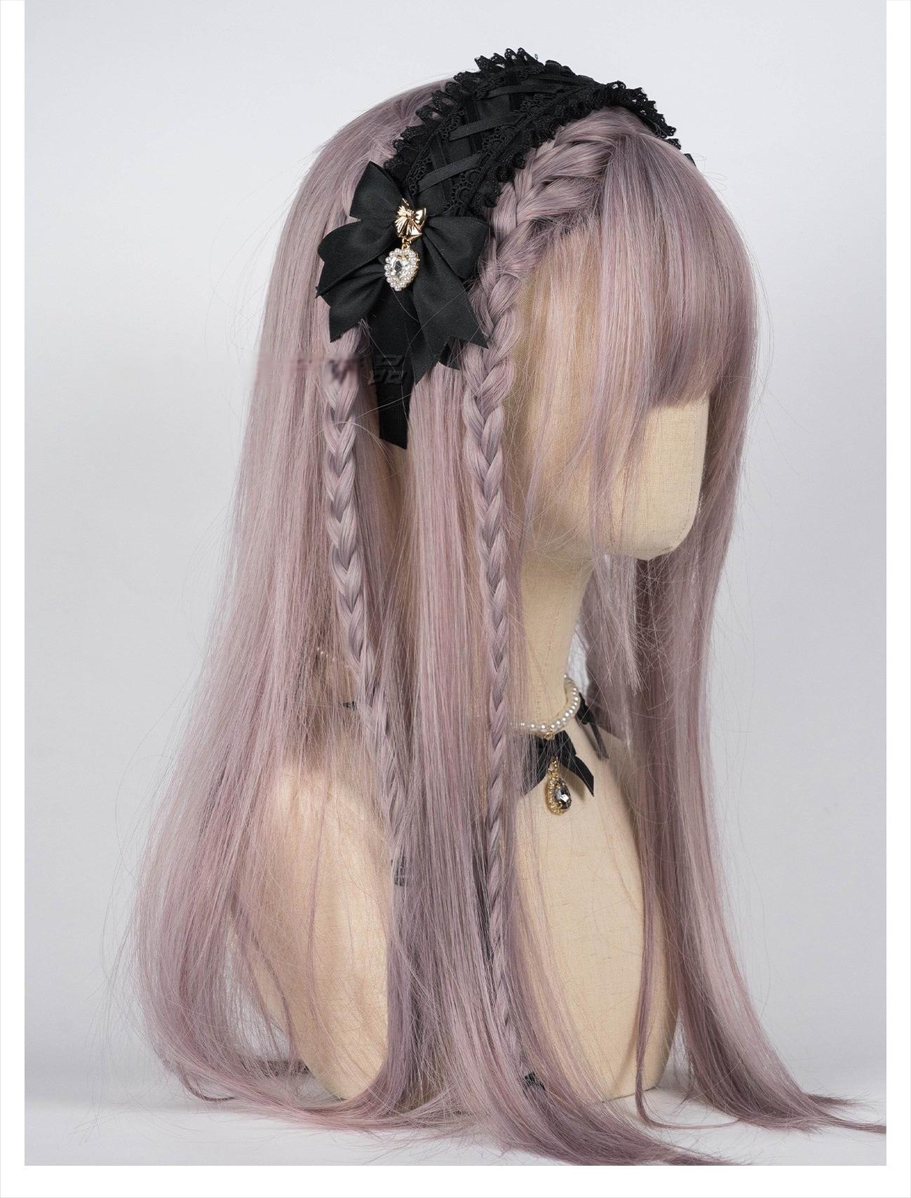 Black Jirai Kei lace headband with satin bow and heart rhinestone pendants worn on mannequin with braided lilac wig, right side view showcasing cross-over ruffled lace design and detailed embellishments