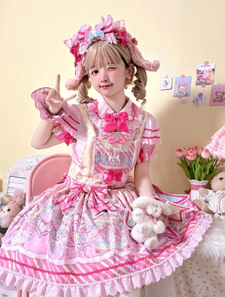 Sweet Lolita carousel printed JSK dress front view with pink ruffled hem and bow decorations on blonde model in bedroom setting