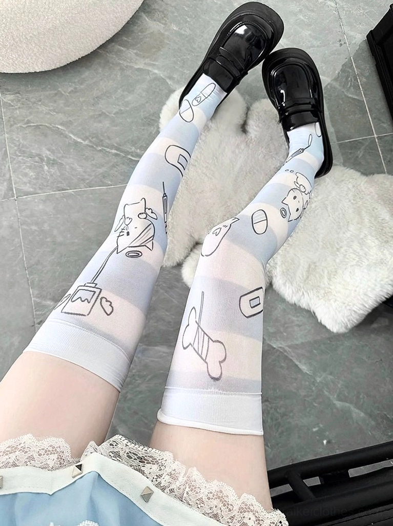 Cartoon angel printed over-the-knee socks with lace skirt trim detail, light blue base with various line art angel and cherub designs, side view on plush rug