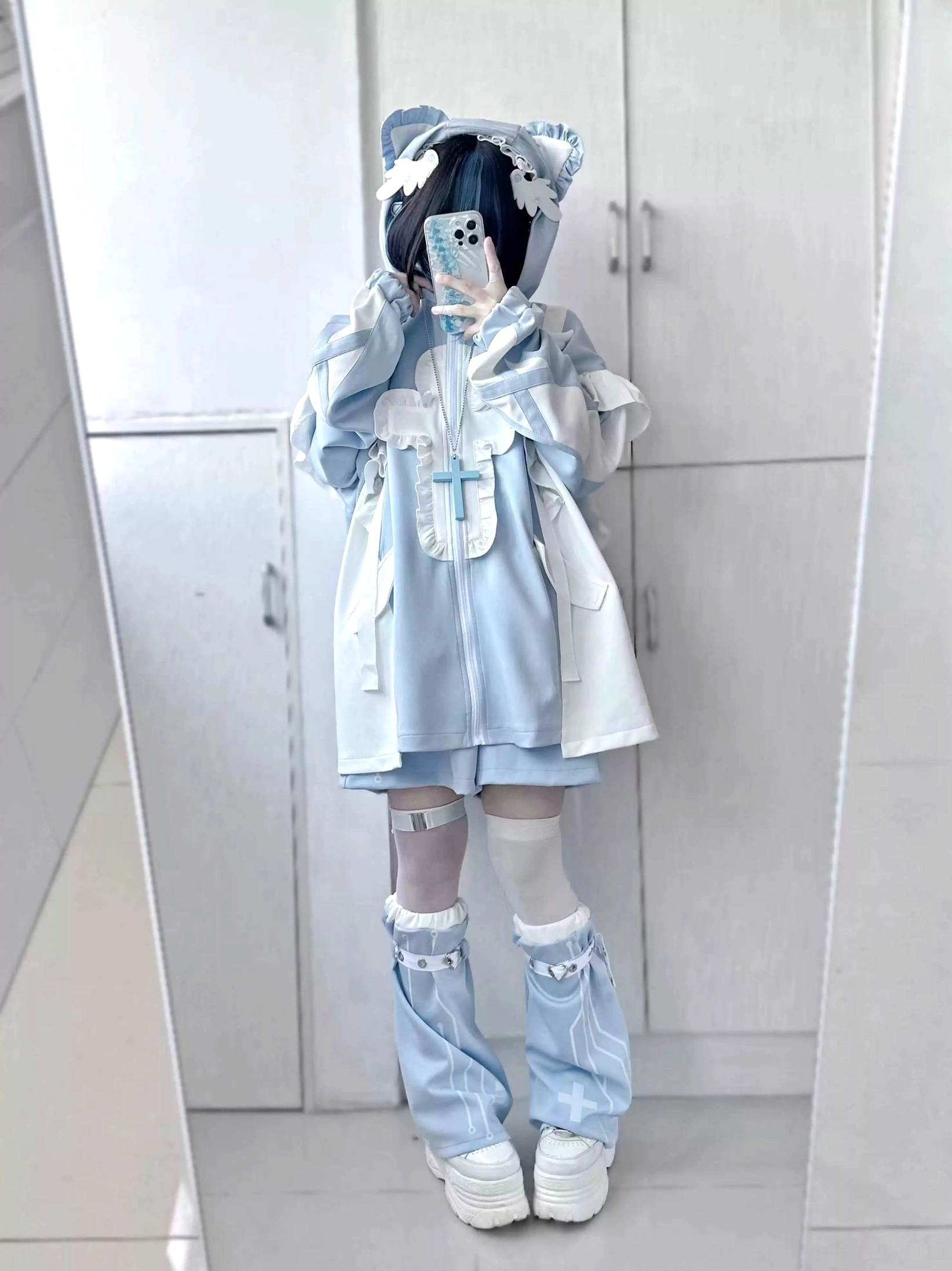 Hooded cat ear blue-white tenshi coat set with flounce trim, oversized fit demonstrated with phone styling, mismatched thigh-high socks and white platform footwear