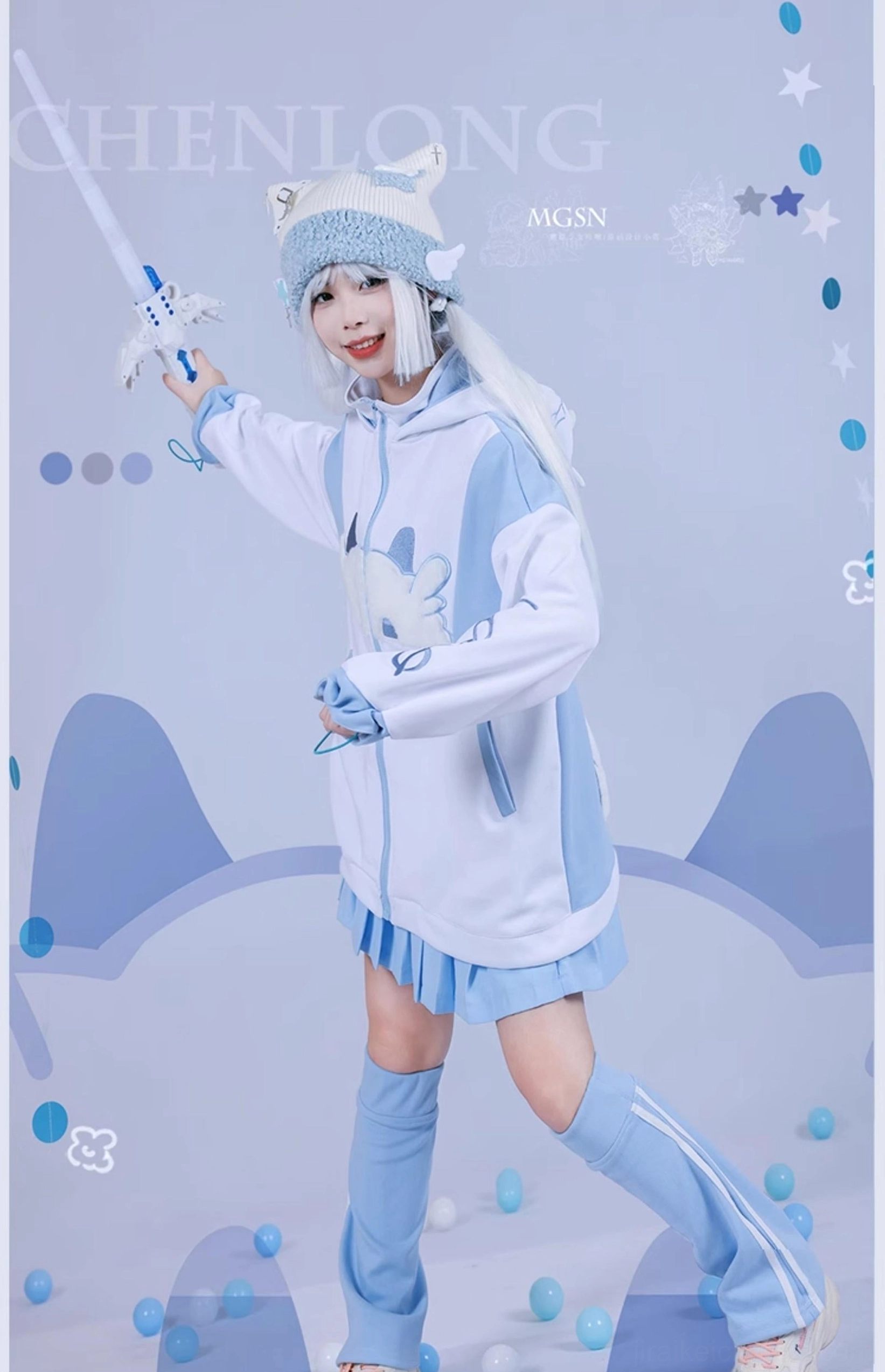 Cat-themed zip-up hoodie with chest pattern and color block sleeves paired with mini pleated skirt, worn by cosplayer holding glowing prop - full standing front view