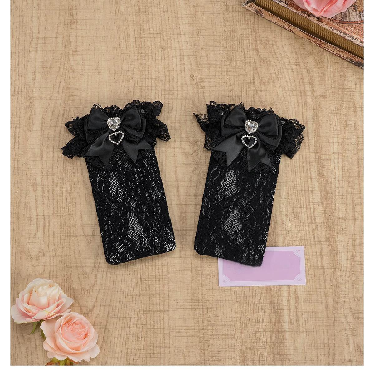 Black-pink lace knee-high Jirai Kei socks with ruffled cuff, pink bow and heart rhinestone embellishment, full length extended view