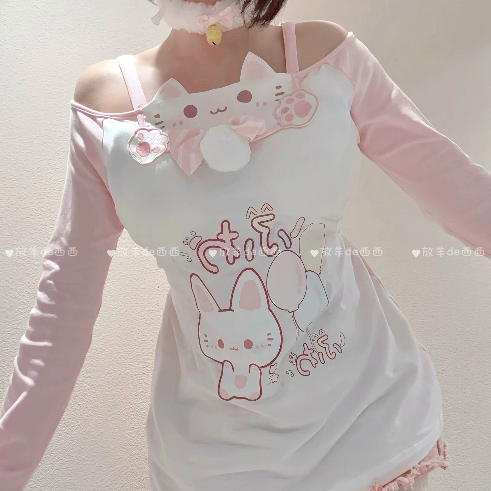 Cat-print off-shoulder top and tiered pink skirt coordinate complete outfit detail shot, displaying layered construction, embroidered embellishments, and kawaii aesthetic design elements