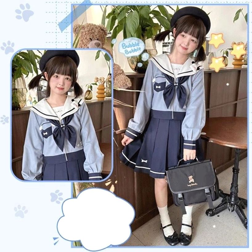 Complete sailor JK uniform Jirai Kei set frontal full-body standing view twin-tailed girl indoor cafe carrying school bag matching top hat styled ensemble