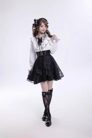 Contrast ruffled Jirai Kei blouse with rhinestone heart buttons full front model view showing tiered skirt coordination